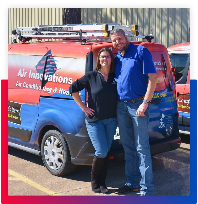 two people standing next to a work van